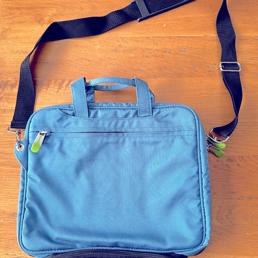 Laptop/Tablet bag: Holds devices up to 10x13” . 3 pockets and detachable strap.
